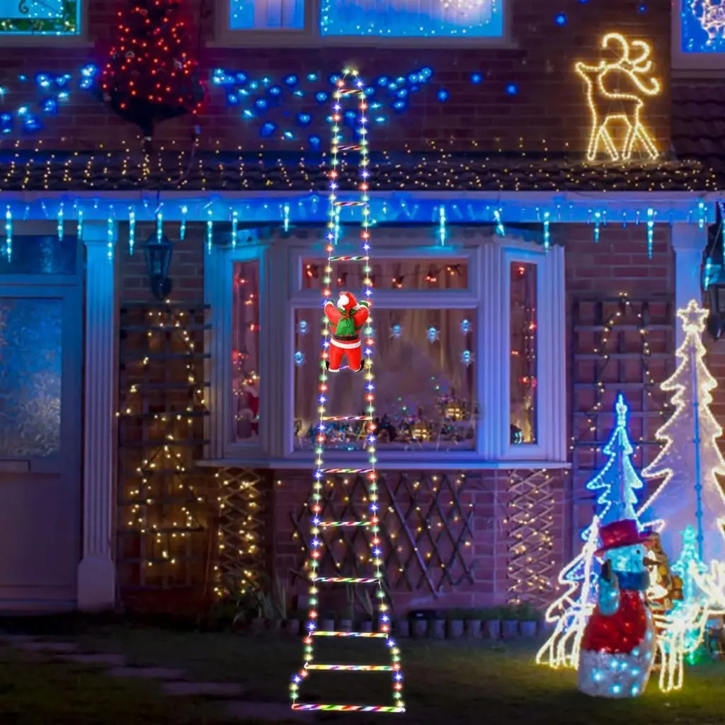 casa do papai noel pendurado na escada iluminação jardim natal tazmo casa 
